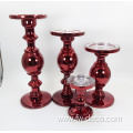 red colored large glass candlestick holder